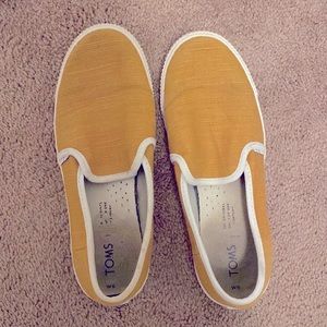 Toms yellow slip on sneakers. Worn but in great condition! Very comfortable